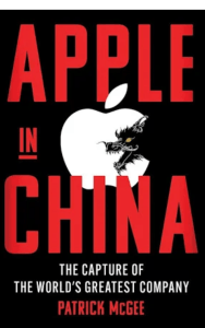 Book cover of &lsquo;Apple in China: The Capture of the World’s Greatest Company&rsquo; by Patrick McGee. Features bold red and white typography on a black background, with a stylized Apple logo partially bitten by a fierce Chinese dragon. A New York Times bestseller exploring Apple’s complex relationship with China and global supply chains.